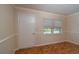 Spare bedroom with hardwood floors and neutral walls at 8653 Sw 96Th St # A, Ocala, FL 34481