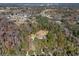 House nestled in a wooded area, near other homes at 995 Sw 37Th Place Rd, Ocala, FL 34471