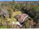 House with pool and large backyard surrounded by trees at 995 Sw 37Th Place Rd, Ocala, FL 34471