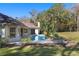 Serene backyard oasis featuring a pool, spa, and lush landscaping at 995 Sw 37Th Place Rd, Ocala, FL 34471