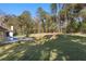 Expansive grassy backyard with a view of the pool and house at 995 Sw 37Th Place Rd, Ocala, FL 34471