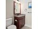 Small bathroom with granite vanity and toilet at 995 Sw 37Th Place Rd, Ocala, FL 34471