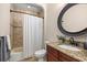 Bathroom with decorative tiling, a granite countertop, and a shower at 995 Sw 37Th Place Rd, Ocala, FL 34471