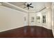 Spacious bedroom featuring hardwood floors, plantation shutters, and a ceiling fan at 995 Sw 37Th Place Rd, Ocala, FL 34471