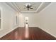Bedroom with hardwood floors and views into another room at 995 Sw 37Th Place Rd, Ocala, FL 34471