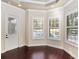 Bright bedroom with hardwood floors, plantation shutters, and private access to the outdoors at 995 Sw 37Th Place Rd, Ocala, FL 34471