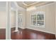 Bright dining room with hardwood floors and large window at 995 Sw 37Th Place Rd, Ocala, FL 34471