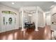 Elegant dining room boasts coffered ceilings, stylish lighting, and rich hardwood flooring at 995 Sw 37Th Place Rd, Ocala, FL 34471