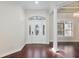 Bright and spacious entryway with hardwood floors and a large front door at 995 Sw 37Th Place Rd, Ocala, FL 34471