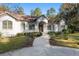 Stunning one-story home with a brick walkway leading to the front entrance at 995 Sw 37Th Place Rd, Ocala, FL 34471