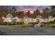 Stunning home exterior at dusk, showcasing architectural details and landscaping at 995 Sw 37Th Place Rd, Ocala, FL 34471
