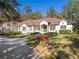 Beautiful one-story home with a large front yard, landscaping, and driveway at 995 Sw 37Th Place Rd, Ocala, FL 34471