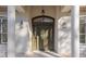 Detailed view of the front door, showcasing the decorative glass and hardware at 995 Sw 37Th Place Rd, Ocala, FL 34471