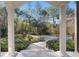 View from the porch showcasing a beautifully landscaped yard and driveway at 995 Sw 37Th Place Rd, Ocala, FL 34471