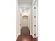 Bright hallway with hardwood floors and neutral walls at 995 Sw 37Th Place Rd, Ocala, FL 34471