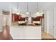 Modern kitchen with granite counters, island and stainless steel appliances at 995 Sw 37Th Place Rd, Ocala, FL 34471