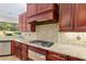 Well-equipped kitchen with gas cooktop and granite countertops at 995 Sw 37Th Place Rd, Ocala, FL 34471