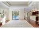 Bright living room with hardwood floors, fireplace, and sliding doors to pool area at 995 Sw 37Th Place Rd, Ocala, FL 34471