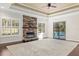 Living area with fireplace, pool view, and hardwood floors at 995 Sw 37Th Place Rd, Ocala, FL 34471