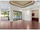 Open living space with hardwood floors and views of the backyard pool at 995 Sw 37Th Place Rd, Ocala, FL 34471