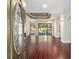 Open living room with hardwood floors and sliding glass doors leading to the pool at 995 Sw 37Th Place Rd, Ocala, FL 34471