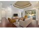 Bright living room with hardwood floors, fireplace, and access to pool at 995 Sw 37Th Place Rd, Ocala, FL 34471
