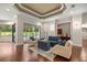 Spacious living room with hardwood floors, stylish furniture, and seamless connection to other living areas at 995 Sw 37Th Place Rd, Ocala, FL 34471
