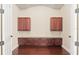 Spacious home office with built-in cabinets and hardwood floors at 995 Sw 37Th Place Rd, Ocala, FL 34471
