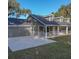 Gray house with attached garage, and a spacious driveway at 000 Ne 30Th Ct, Reddick, FL 32686