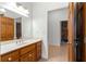 Bathroom with wood vanity and stone countertop at 10320 Sw 103Rd Ct, Ocala, FL 34481