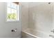 Simple bathroom with shower/tub and window at 10320 Sw 103Rd Ct, Ocala, FL 34481