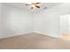 Bedroom with ceiling fan and access to bathroom at 10320 Sw 103Rd Ct, Ocala, FL 34481