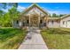 House exterior featuring stone accents and a covered porch at 10320 Sw 103Rd Ct, Ocala, FL 34481