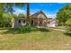 House exterior with a tree-lined front yard at 10320 Sw 103Rd Ct, Ocala, FL 34481