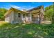 Side view of house showcasing stonework and landscaping at 10320 Sw 103Rd Ct, Ocala, FL 34481