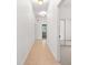 Long hallway with tile floor and light fixtures at 10320 Sw 103Rd Ct, Ocala, FL 34481