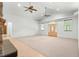 Bright living room with high ceilings and access to the front door at 10320 Sw 103Rd Ct, Ocala, FL 34481