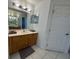 Bathroom with double vanity and wood cabinets at 1060 Sw Big Tree Rd, Dunnellon, FL 34431