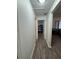 Bright hallway with wood-look floors leading to bedrooms at 1060 Sw Big Tree Rd, Dunnellon, FL 34431