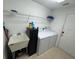 Laundry room with washer, dryer, and utility sink at 1060 Sw Big Tree Rd, Dunnellon, FL 34431