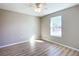 Bright bedroom with vinyl plank flooring and a large window at 10856 Sw 79Th Ave, Ocala, FL 34476