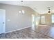 Dining area with vinyl plank flooring and a modern chandelier at 10856 Sw 79Th Ave, Ocala, FL 34476