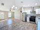 Modern kitchen featuring stainless steel appliances and white cabinets at 10856 Sw 79Th Ave, Ocala, FL 34476