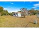 Large backyard with mature trees and grassy area at 11518 Sw 136Th Pl, Dunnellon, FL 34432