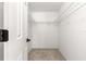 Walk-in closet with wire shelving and neutral carpet at 11518 Sw 136Th Pl, Dunnellon, FL 34432