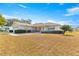 Single-story home with attached garage and manicured lawn at 11518 Sw 136Th Pl, Dunnellon, FL 34432