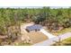 Aerial view of a single-story house with a large yard and driveway at 117 Nw Sparrow Rd, Dunnellon, FL 34431