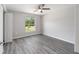 Bedroom with ceiling fan and vinyl plank flooring at 117 Nw Sparrow Rd, Dunnellon, FL 34431