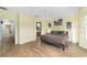 Bright bedroom with hardwood floors and ensuite bathroom access at 12531 Se 90Th Ter, Summerfield, FL 34491