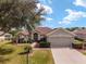 One-story home with a two-car garage and landscaped yard at 12531 Se 90Th Ter, Summerfield, FL 34491